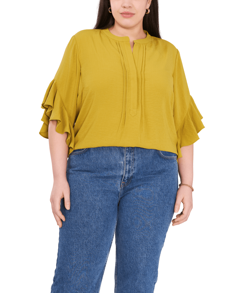 Front of a model wearing a size 1X Aubrey Ruffle Sleeve Blouse in Avocado by Vince Camuto. | dia_product_style_image_id:261504